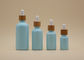 Colori le bottiglie di olio essenziale degli azzurri 15ml 30ml della glassa con il contagoccia di bambù