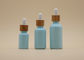 Colori le bottiglie di olio essenziale degli azzurri 15ml 30ml della glassa con il contagoccia di bambù